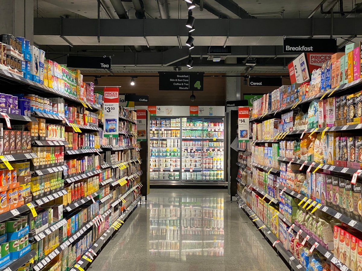 Supermarket aisle stocked with fast-moving consumer goods